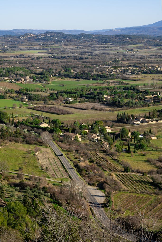 Aerial view of scenic landscapes in Gordes, Provence, with lush greenery and rural charm.